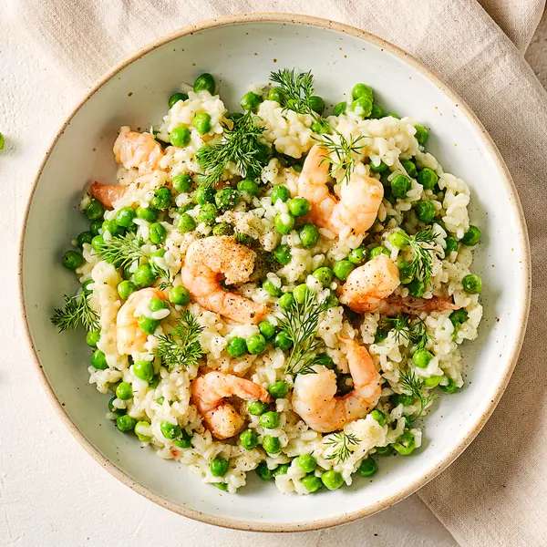 Risotto met knoflookgarnalen en erwtjes