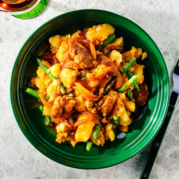 Surinaamse stijl stamppot met kip en boontjes