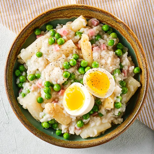Risotto met witte asperges, doperwten en ham
