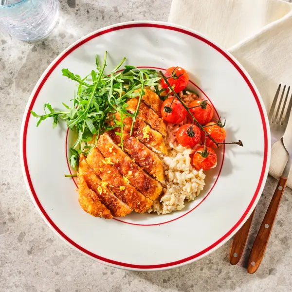 Romige orzo met krokante kipschnitzel