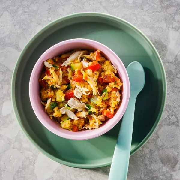 Couscous, kip, paprika en courgette met komijnzaad